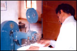 Another Trainee operates the pinning machine  all concentration, click here to see large picture.