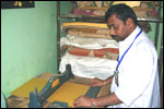 Mr R. Jagadish MR[ with HH], Trainee of LEKHADEEP at the VTC - operates the File Creasing Machine, click here to see large picture.