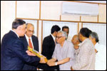 Shri Vijayendranath Kaul, Hon. CAG of India greets the representatives of LEKHADEEP at Hyderabad. Sri B. Ramajoga Rao President, Sri R. Sambasiva Rao Secretary present a bouquet to him., click here to see large picture.